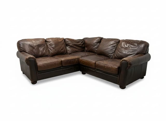 Bradington-Young brown top-grain leather sectional on white background